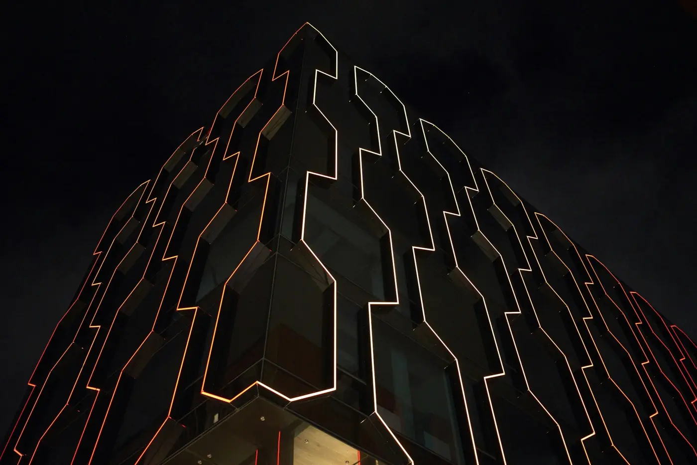 Geometric facade outlined in light