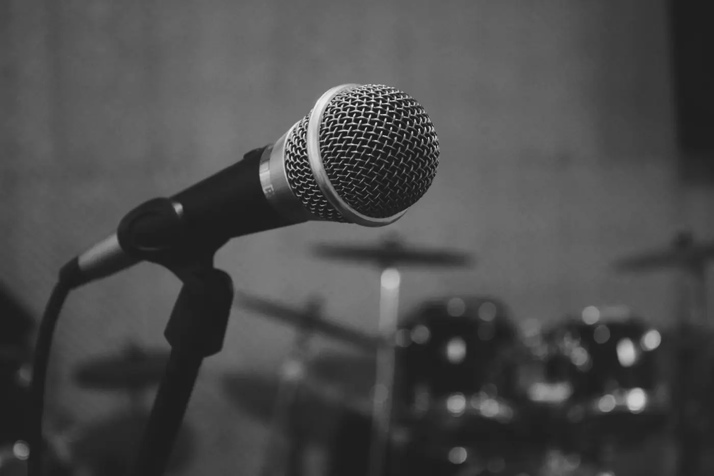 Microphone on stage in front of drums