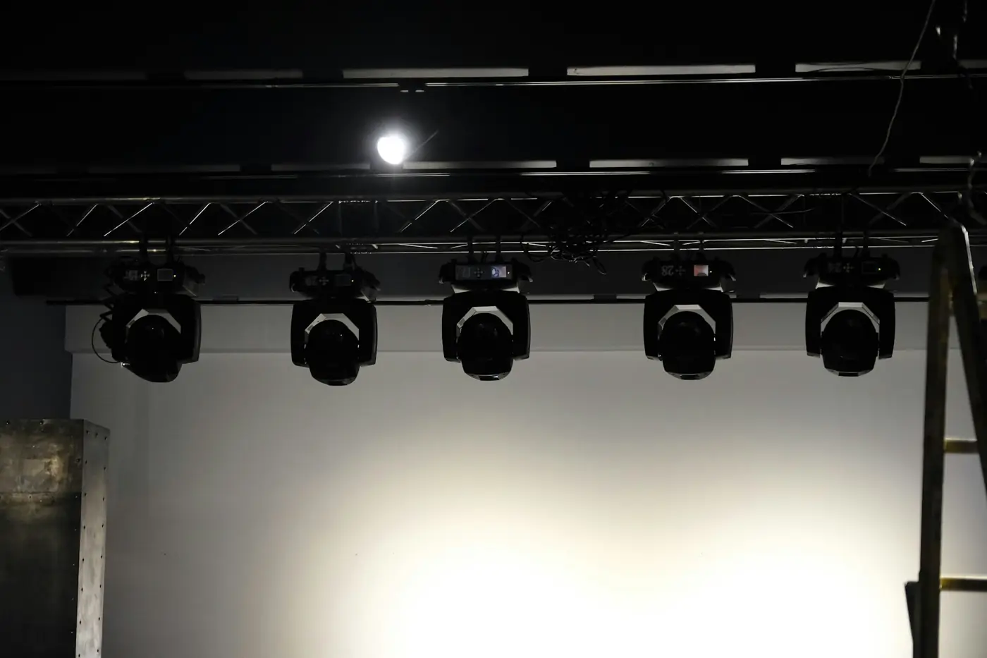 Row of moving heads on truss